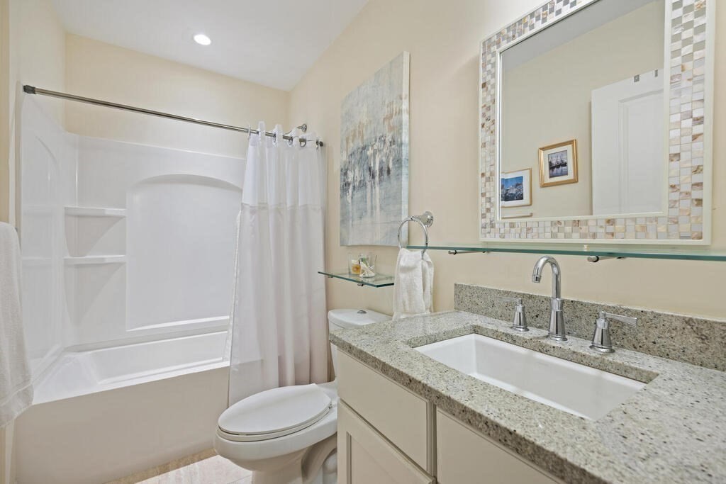 23 Courtyard Place, Unit 23 Lexington, MA 02420 - Photo 22 of 28 a bathroom with a granite countertop sink toilet and shower