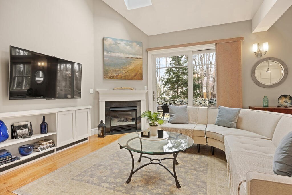 23 Courtyard Place, Unit 23 Lexington, MA 02420 - Photo 5 of 28 a living room with furniture and a flat screen tv