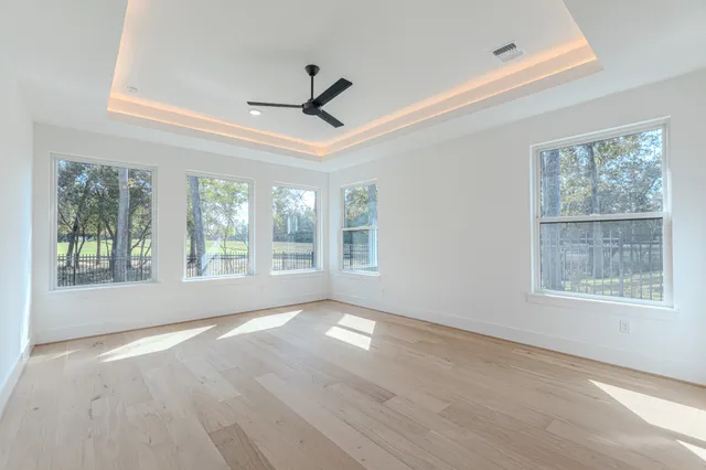 a large kitchen with stainless steel appliances granite countertop a sink and a stove