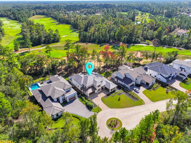 an aerial view of residential house with swimming pool and outdoor space