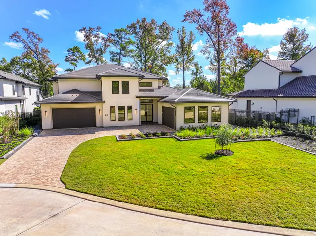 a view of house with swimming pool and porch