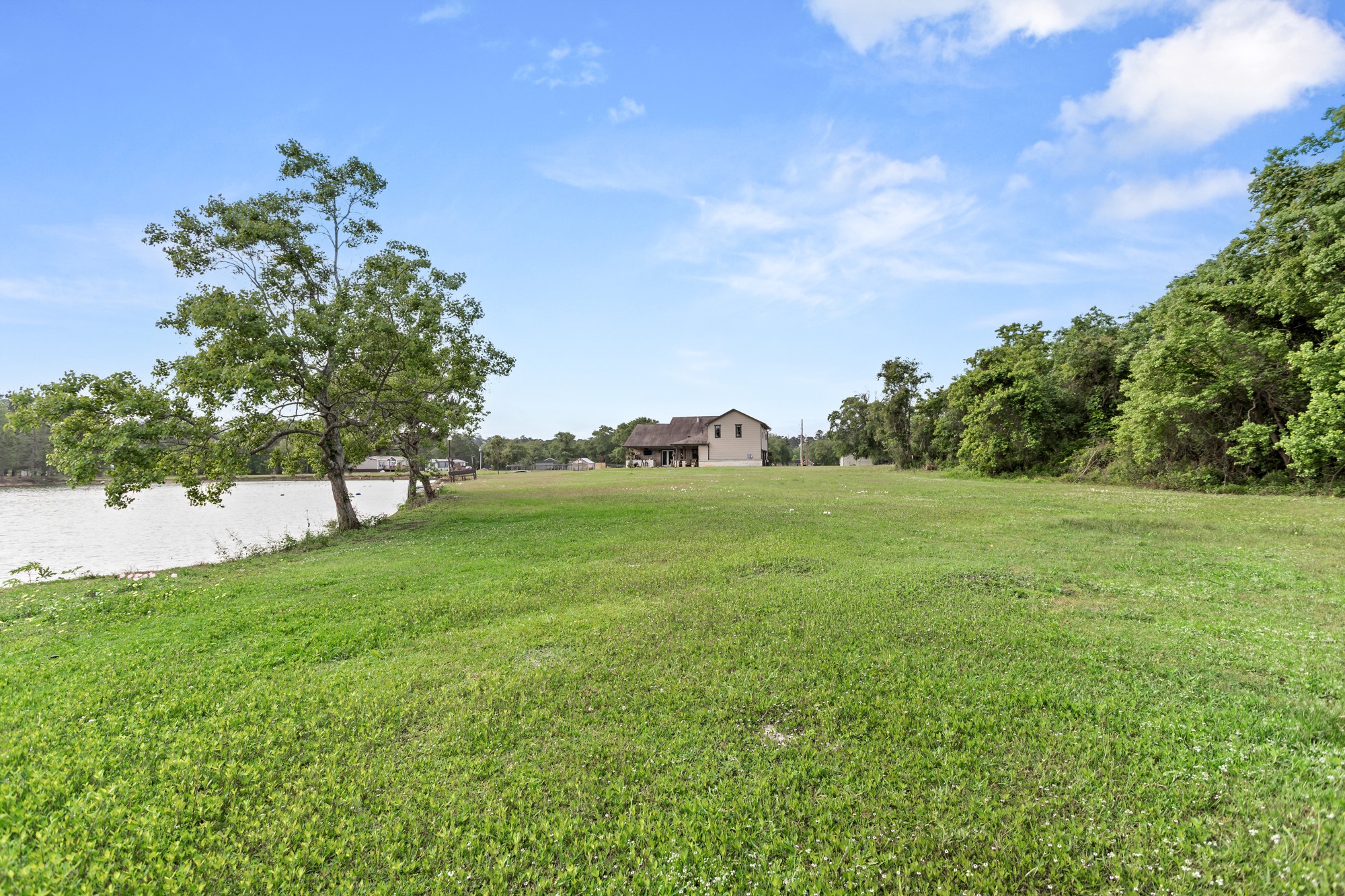 10573 Cooks Lake Road Lumberton, TX 77657 - Photo 40 of 47 a backyard of a house with lots of green space
