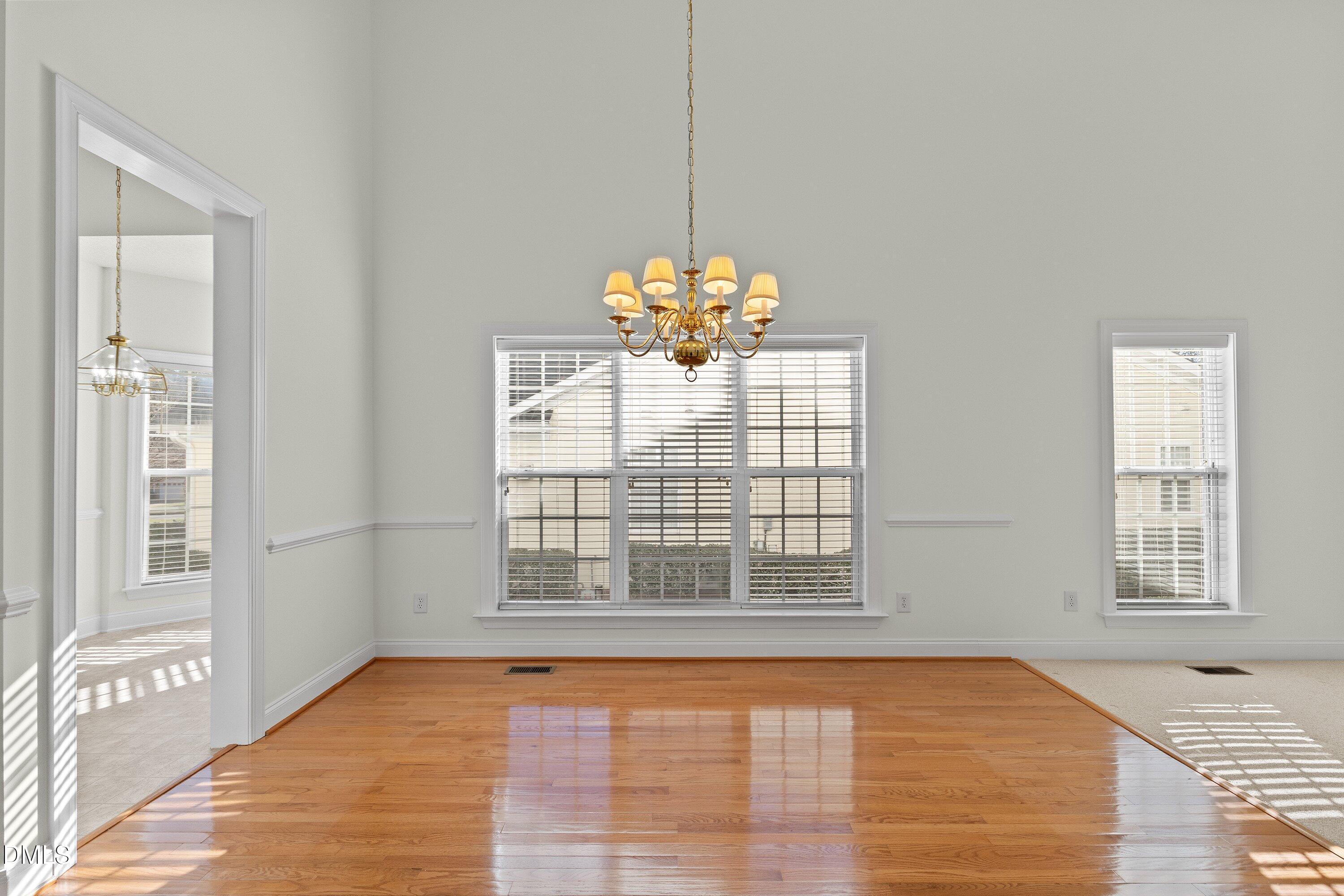 105 Rockport Ridge Way Cary, NC 27519 - Photo 12 of 43 a view of an empty room with a window