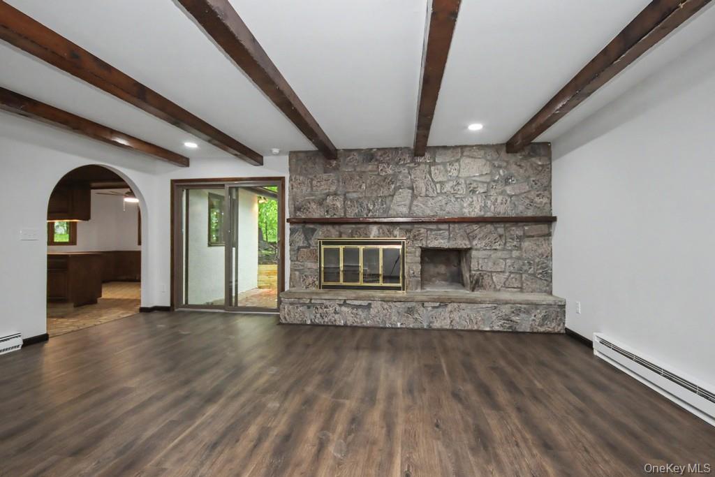 18 Hillside View Road Mahopac, NY 10541 - Photo 18 of 42 a view of an empty room with wooden floor and a window