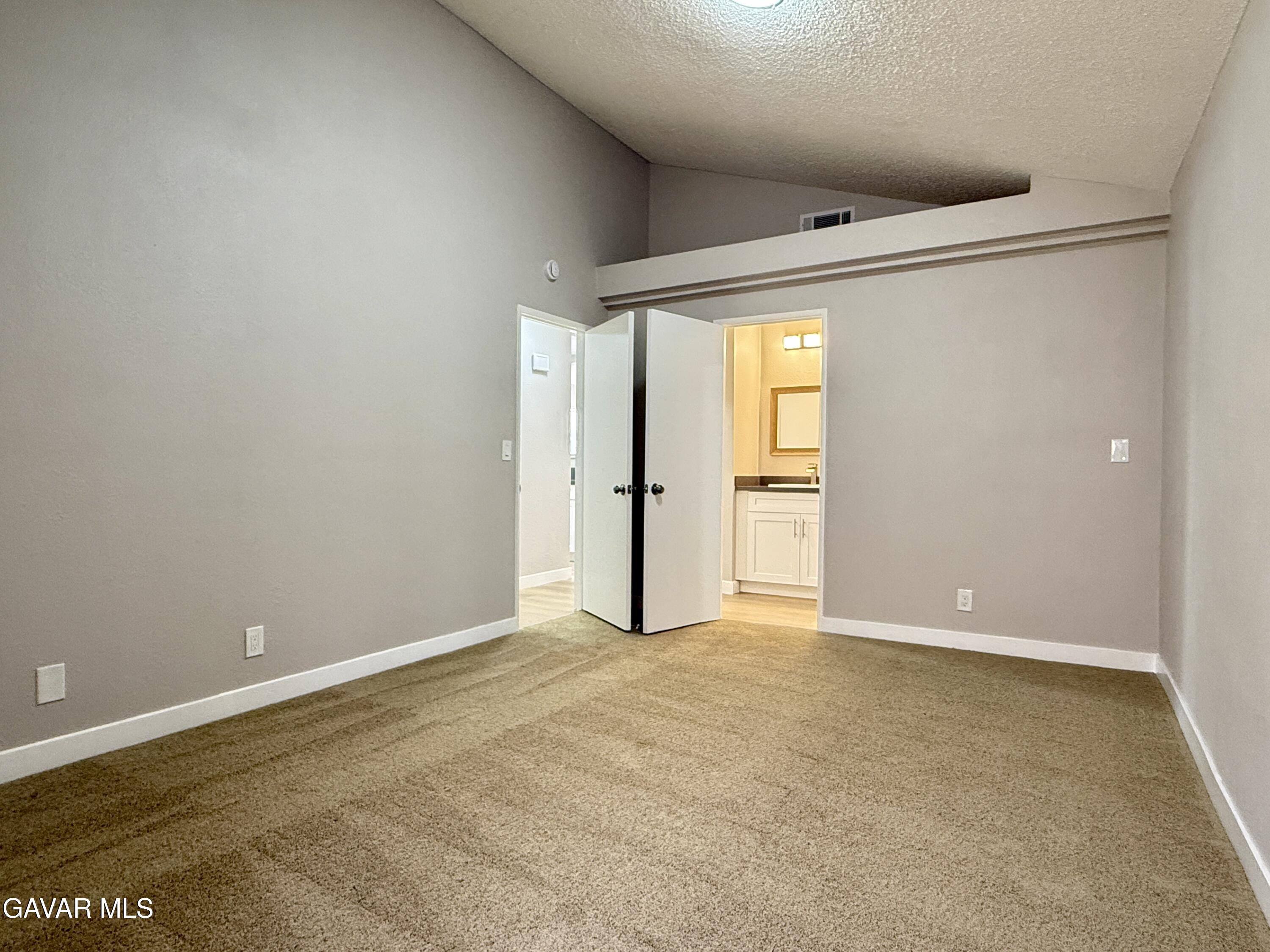 36931 Charter Court Palmdale, CA 93552 - Photo 10 of 20 an empty room with an entryway and a window