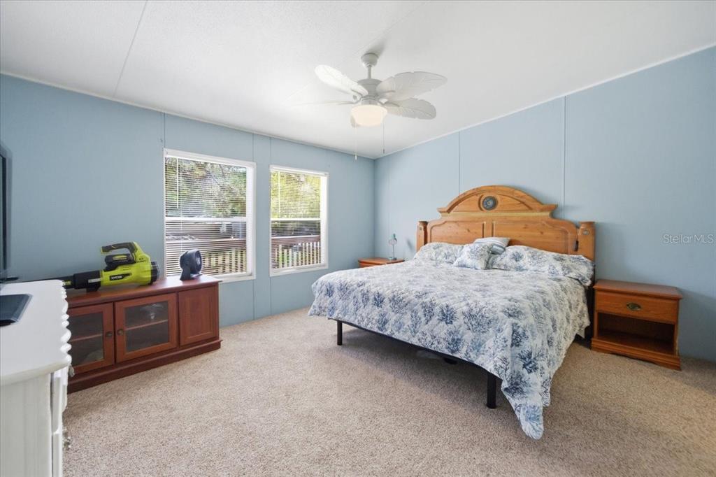 6715 West Richard Drive Weeki Wachee, FL 34607 - Photo 15 of 47 a bedroom with a bed and a window