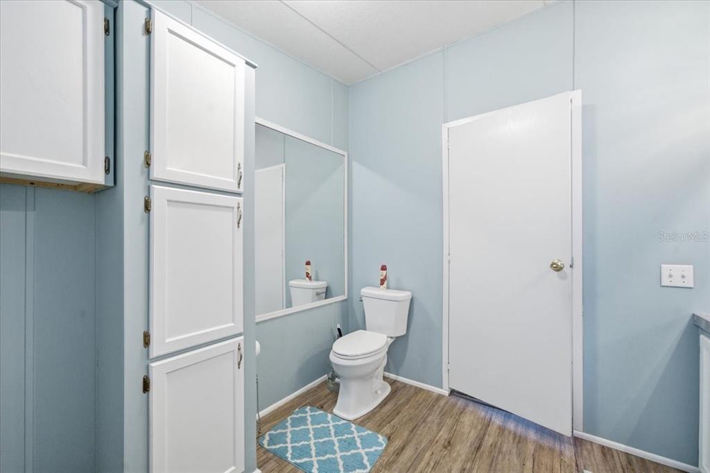 6715 West Richard Drive Weeki Wachee, FL 34607 - Photo 19 of 47 a bathroom with a toilet and a sink