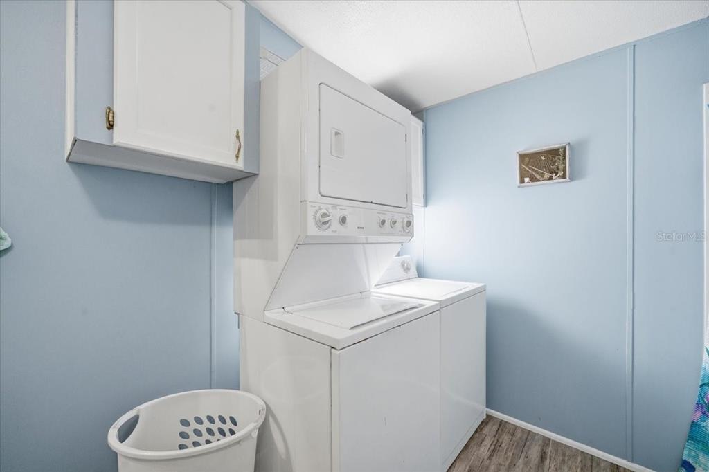 6715 West Richard Drive Weeki Wachee, FL 34607 - Photo 20 of 47 a bathroom with a sink a toilet and a window