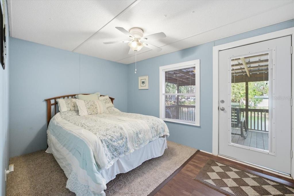 6715 West Richard Drive Weeki Wachee, FL 34607 - Photo 24 of 47 a bedroom with a large bed and a window
