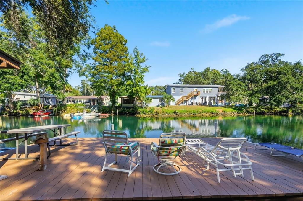 6715 West Richard Drive Weeki Wachee, FL 34607 - Photo 30 of 47 a view of a lake with outdoor seating