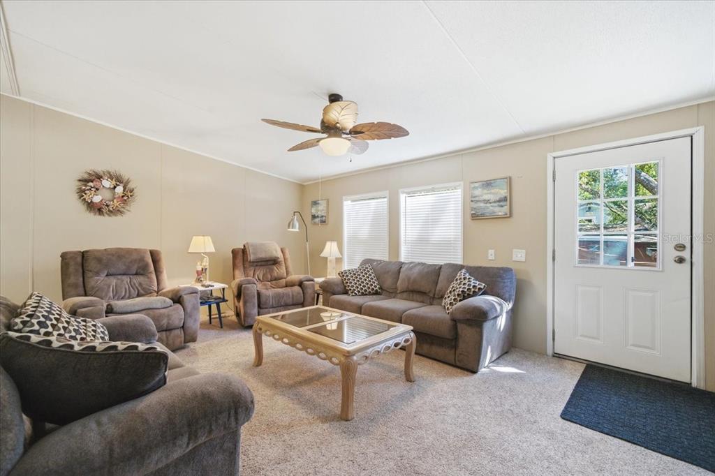 6715 West Richard Drive Weeki Wachee, FL 34607 - Photo 3 of 47 a living room with furniture and a large window