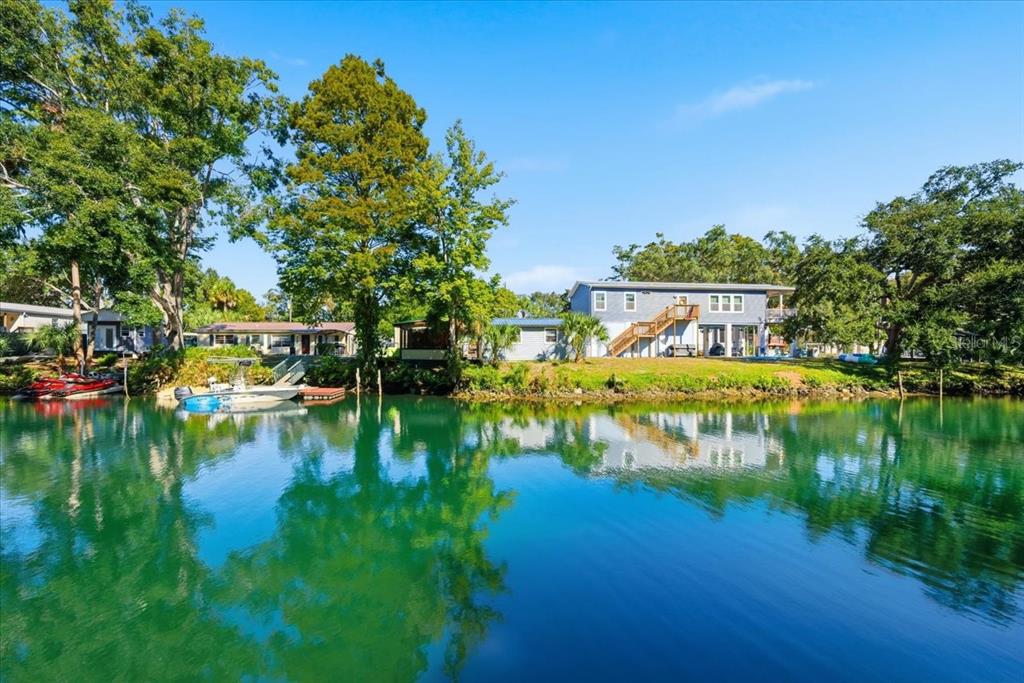 6715 West Richard Drive Weeki Wachee, FL 34607 - Photo 33 of 47 a view of residential house with outdoor space and lake view
