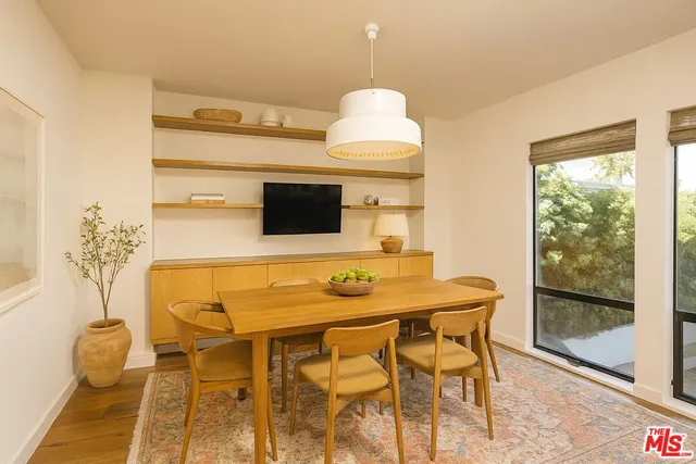 a kitchen with a table and chairs in it