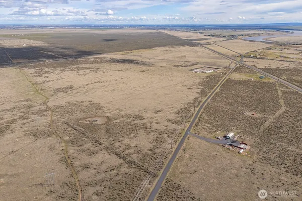a view of beach and small yard