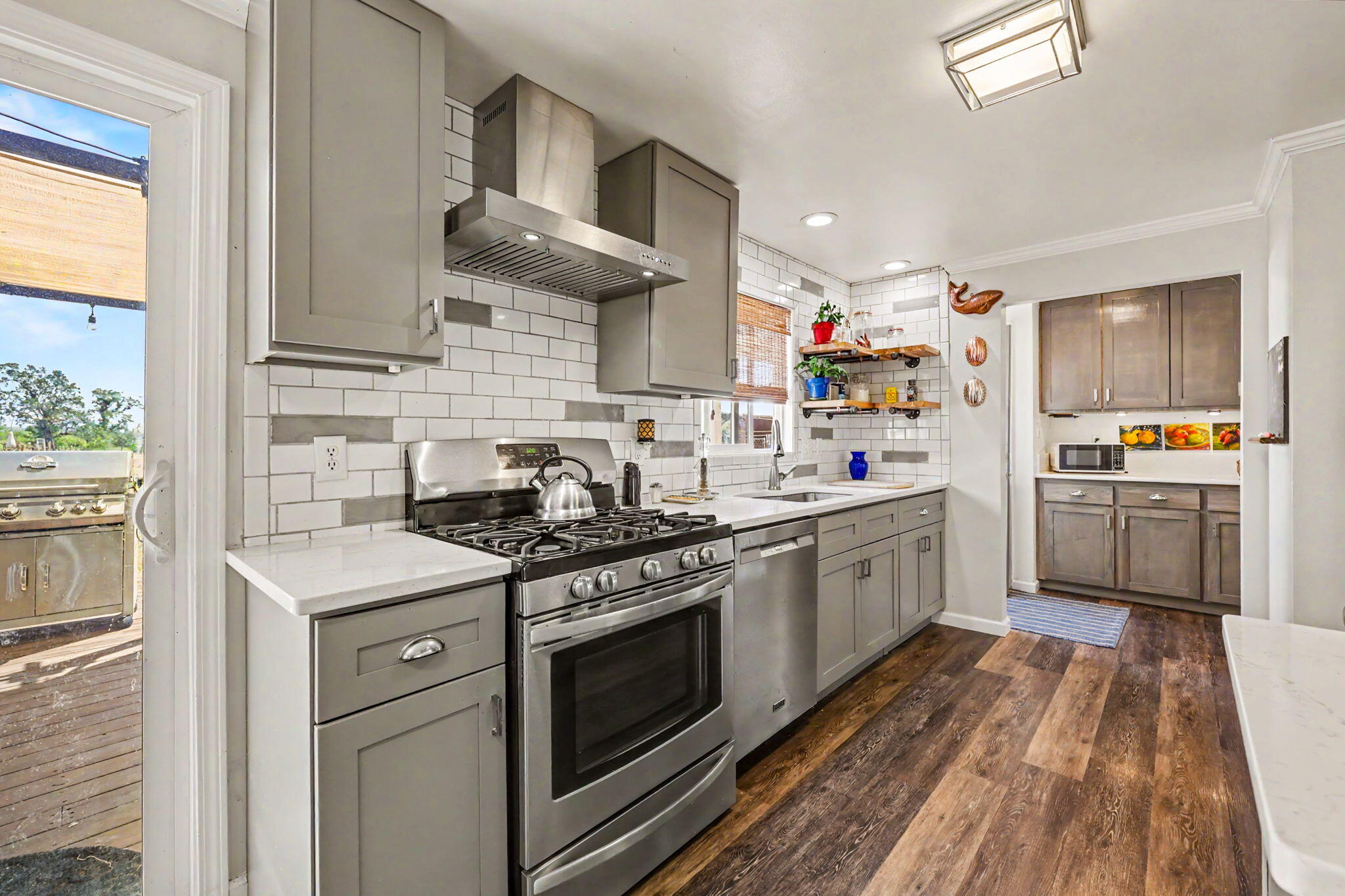 145 Highway 234 Eagle Point, OR 97524 - Photo 10 of 43 a kitchen with stainless steel appliances granite countertop a sink a stove and a refrigerator