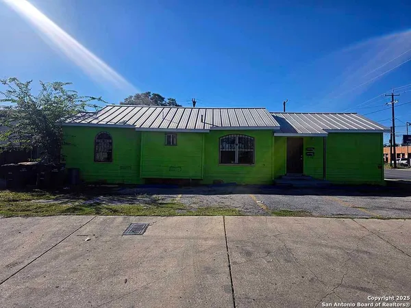 a view of a house with a yard and garage
