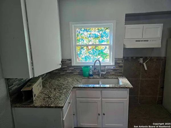 a white refrigerator freezer sitting in a kitchen