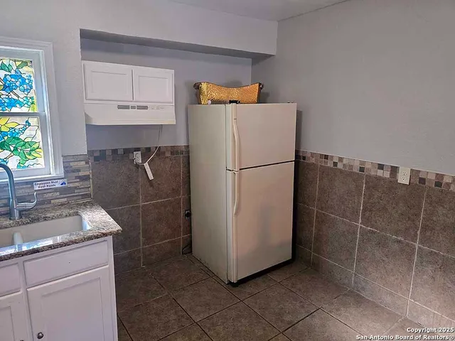 a view of a room with furniture wooden floor and window