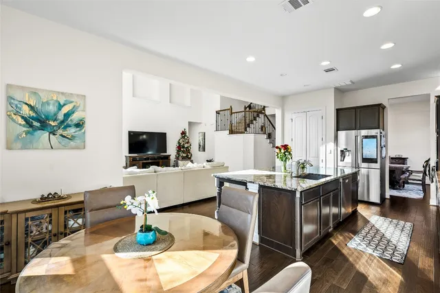 a balcony with furniture and wooden floor