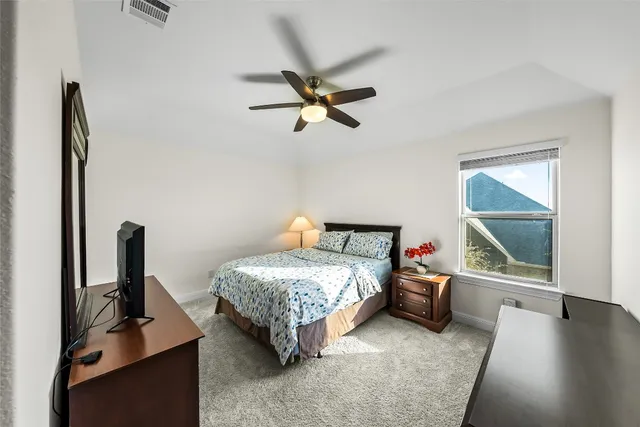 a bathroom with a sink double vanity mirror and a bathtub