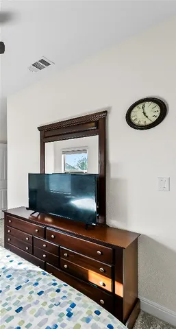 a room with a bed and cabinets