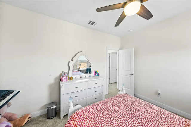 a bedroom with a bed furniture and a window
