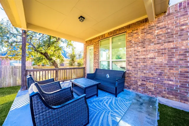 a view of a backyard with sitting area