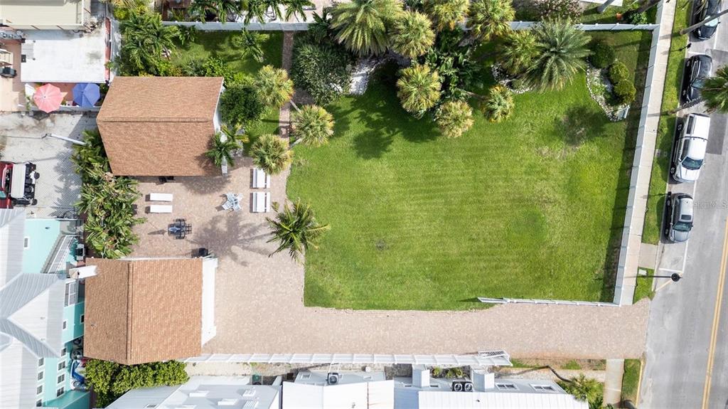 702 Pass A Grille Way St. Pete Beach, FL 33706 - Photo 11 of 41 an aerial view of a house having yard