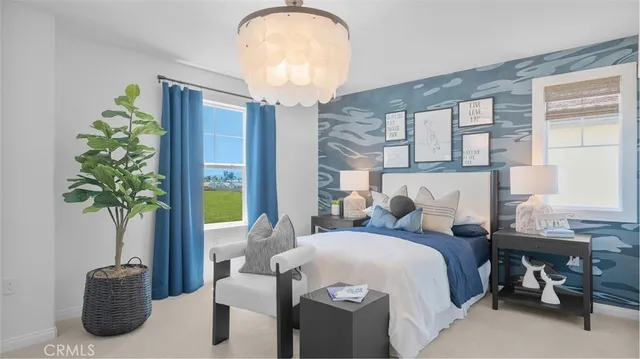 a bed room with a bed and a potted plant