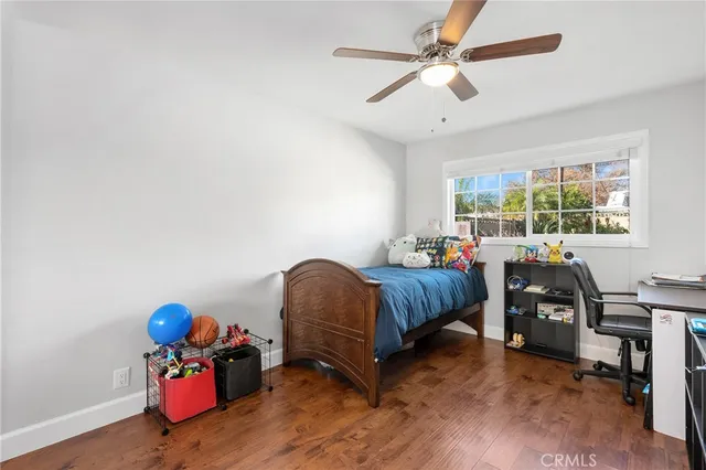 a bedroom with bed and window
