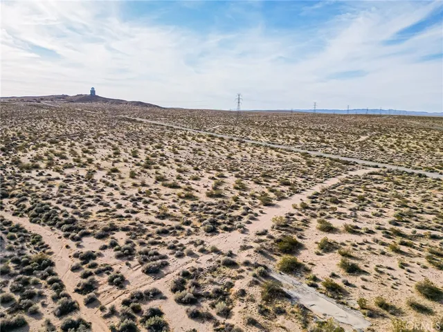 a sign board with parking space in back