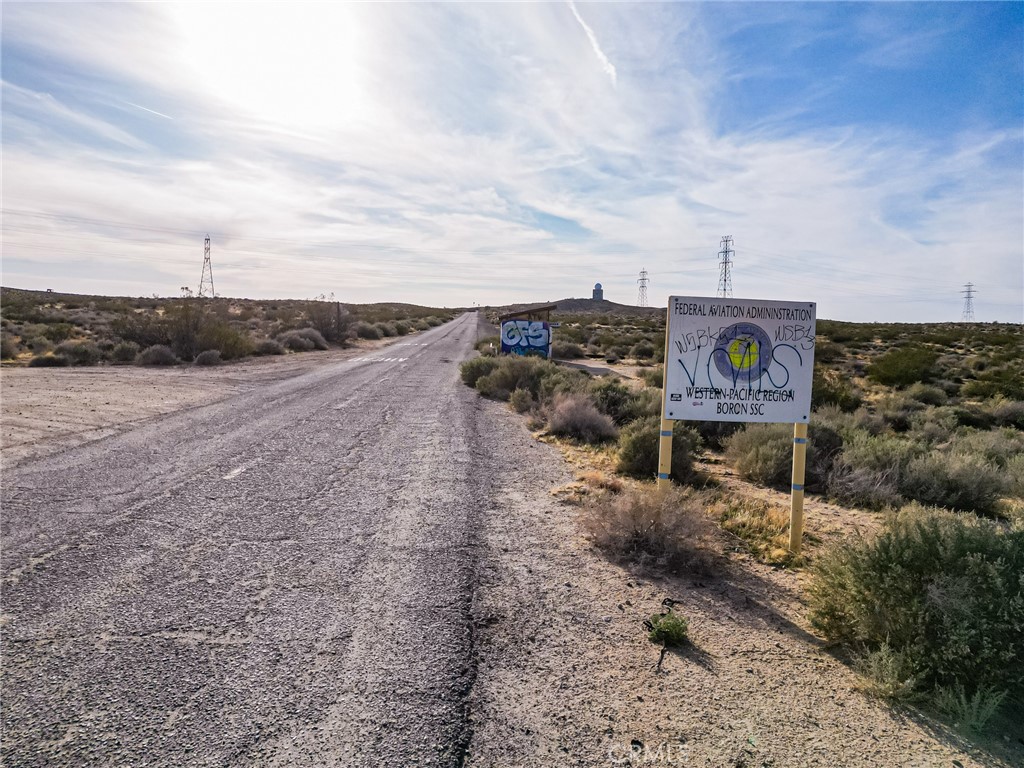 1000 Locust Road Boron, CA 93516 - Photo 28 of 32 a sign board with parking space in back