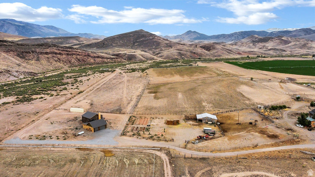 544 East 600 North, Unit 1 Joseph, UT 84739 - Photo 57 of 65 Expansive property featuring multiple structures, including two dark-sided buildings with dark roofs and a lighter-colored barn-style building