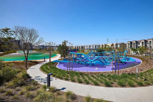a view of a swimming pool with lounge chairs in patio