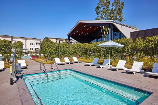 a view of house with outdoor space and swimming pool