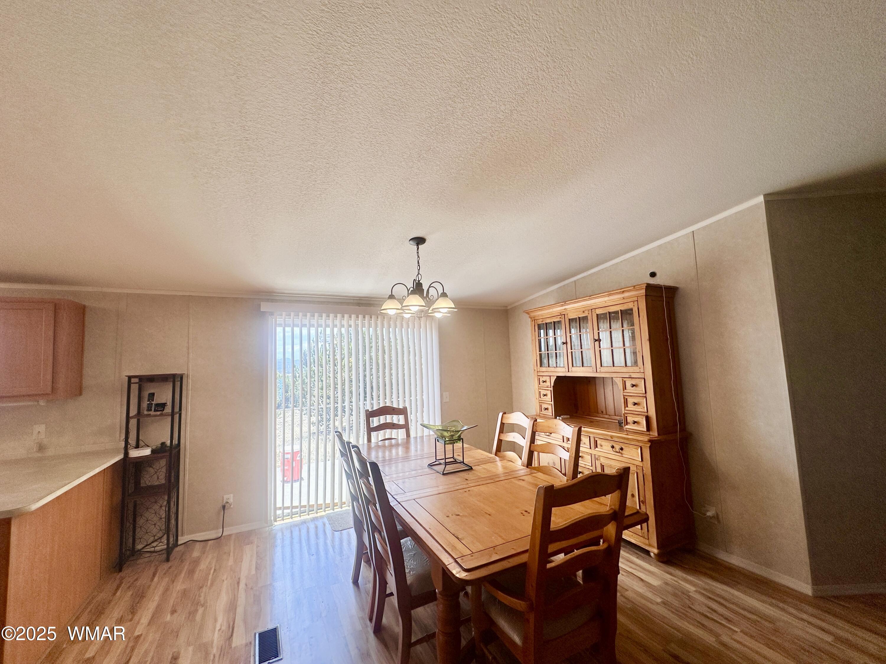 52 County Road Concho, AZ 85924 - Photo 12 of 33 LARGE DINIG ROOM WITH PATIO EXIT