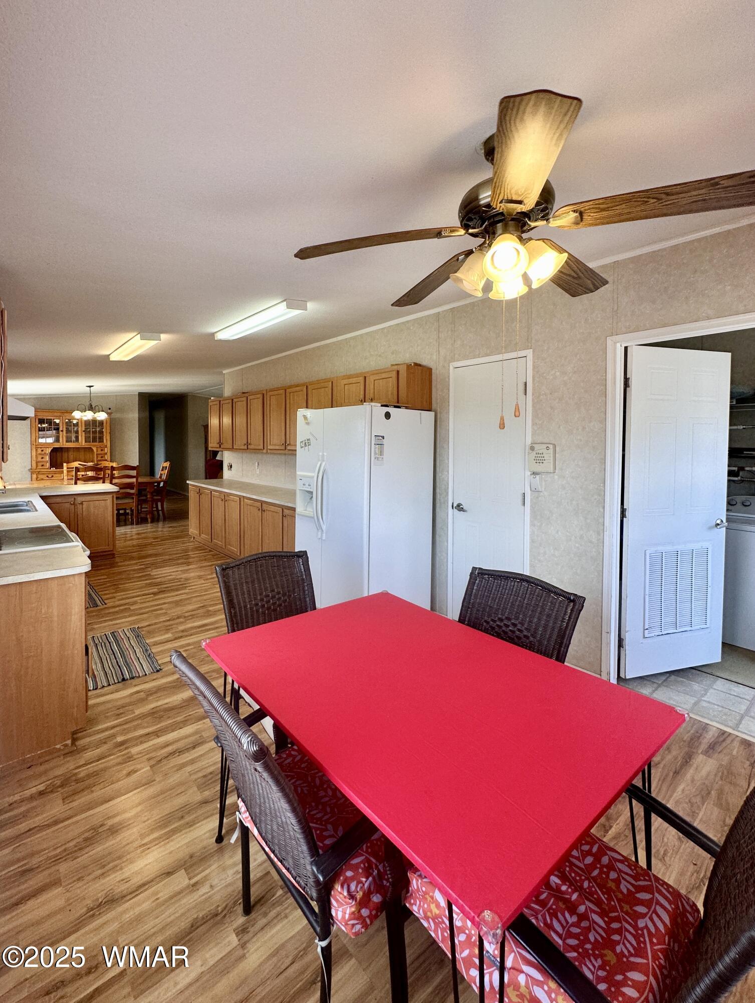 52 County Road Concho, AZ 85924 - Photo 15 of 33 KITCHEN, PANTRY, LR EXIT TO CARPORT
