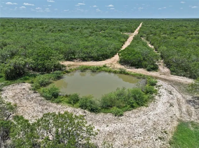 a view of a field with an outdoor space