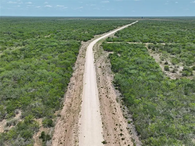 a view of a lake with a yard