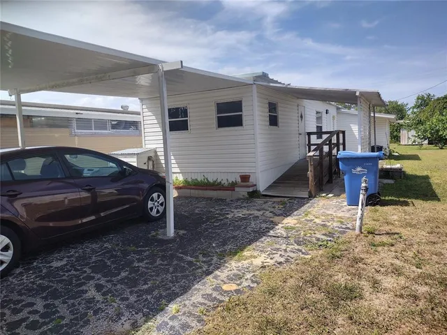 a house view with a backyard space