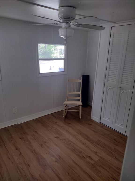 123 Alice Street Edgewater, FL 32141 - Photo 4 of 4 a view of a livingroom with wooden floor and a window