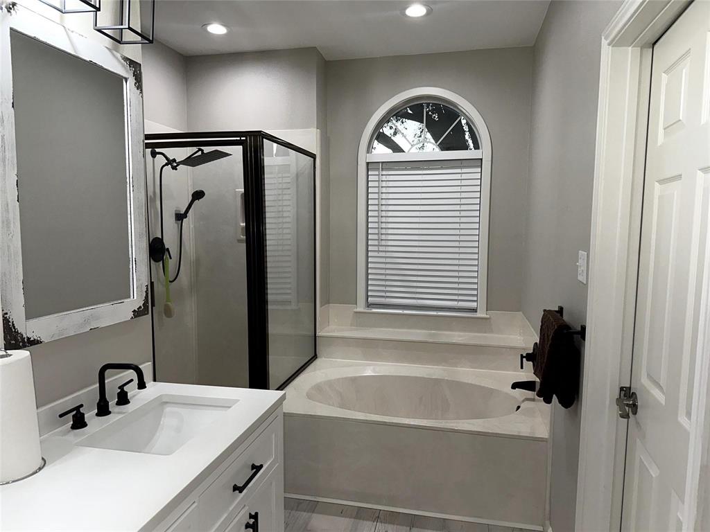 520 Red River Road Belton, TX 76513 - Photo 12 of 36 Bathroom with a garden tub, a stall shower, vanity, and recessed lighting