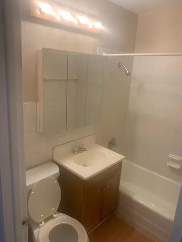 a bathroom with a toilet and sink