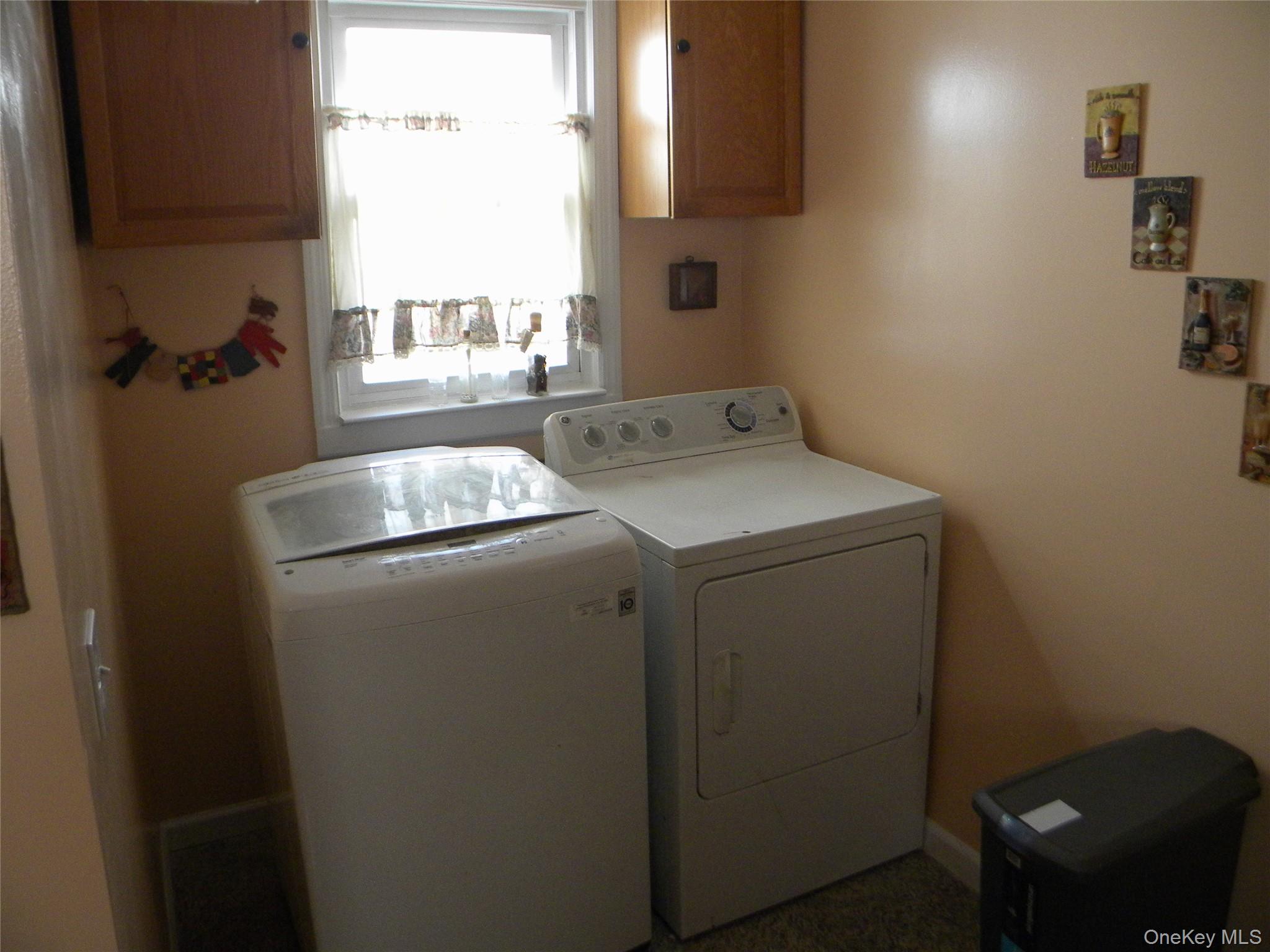 241-26 86th Road Queens, NY 11426 - Photo 11 of 38 a utility room with dryer and washer