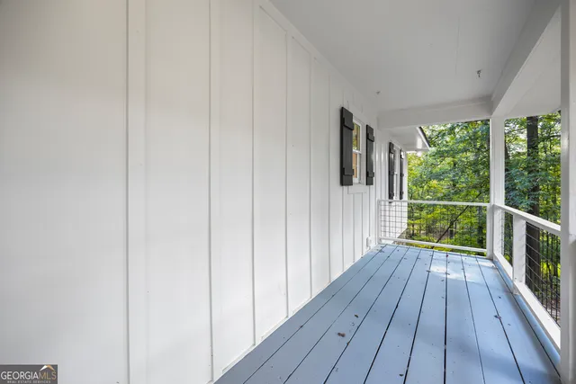 a view of empty room with a fireplace