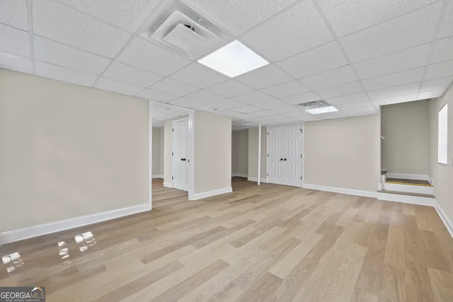 a view of empty room with windows