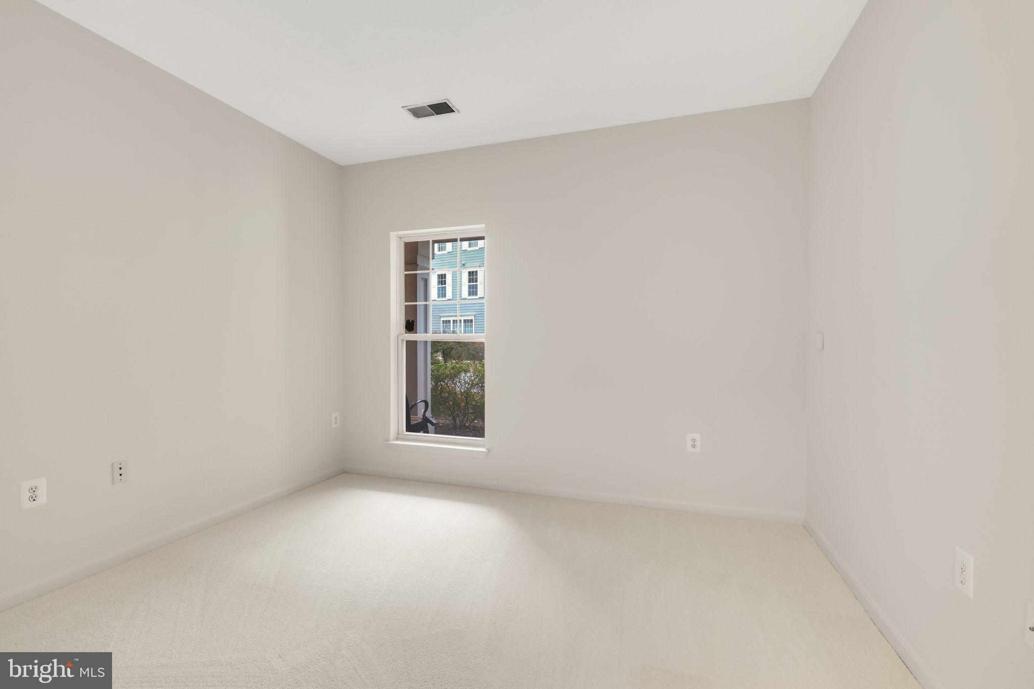 150 Chevy Chase Street, Unit 102 Gaithersburg, MD 20878 - Photo 19 of 41 an empty room with a window
