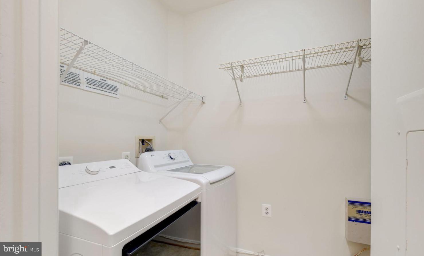 150 Chevy Chase Street, Unit 102 Gaithersburg, MD 20878 - Photo 22 of 41 a utility room with dryer and washer