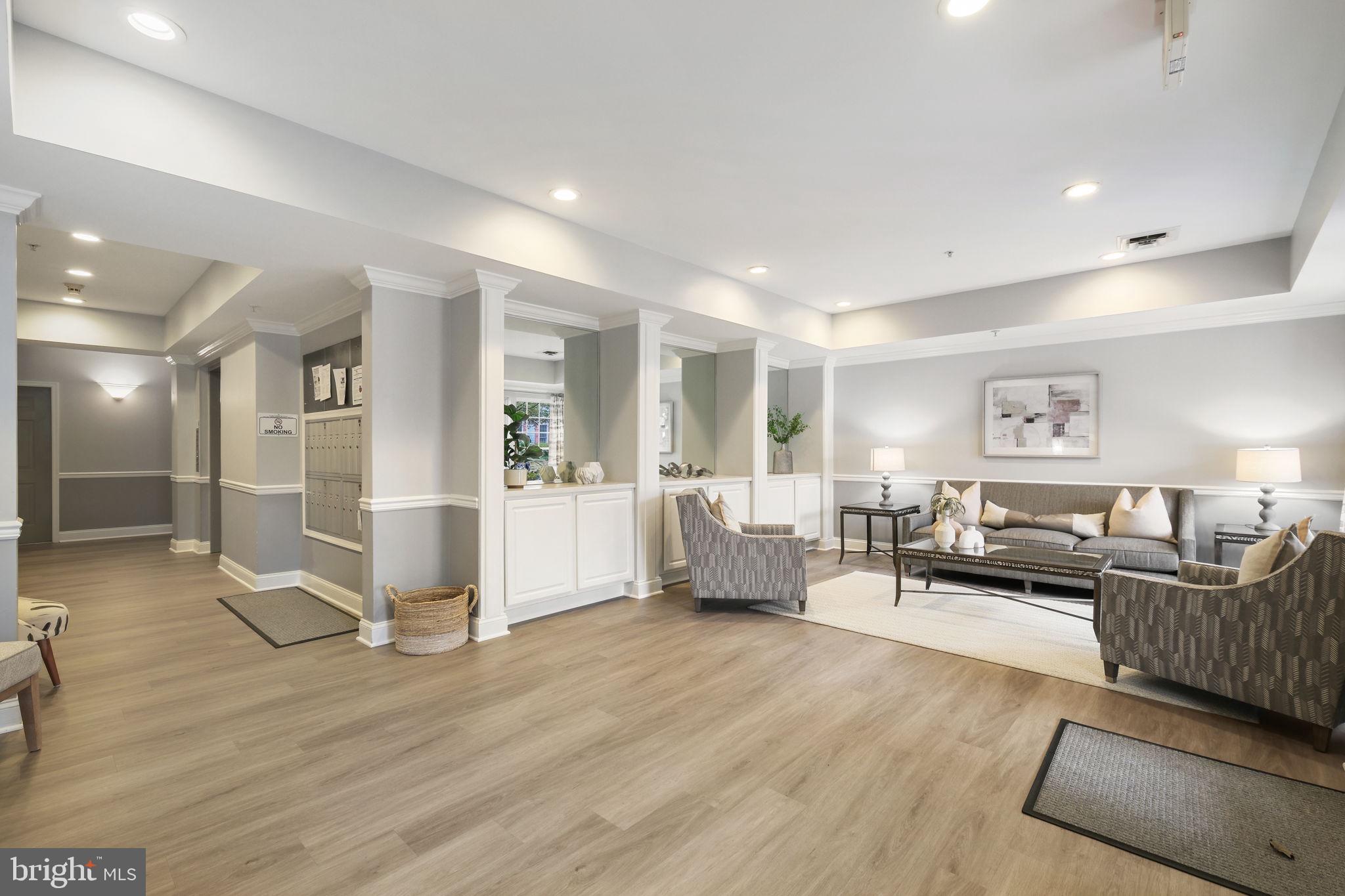 150 Chevy Chase Street, Unit 102 Gaithersburg, MD 20878 - Photo 25 of 41 a living room with furniture and wooden floor