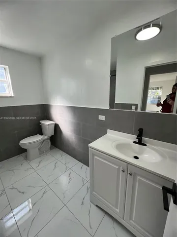 a bathroom with a sink and a toilet